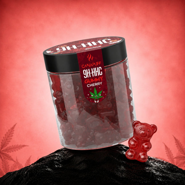 Canapuff 9H-HHC Gummy Cherry у прозорій банці з чорною кришкою на кораловому фоні